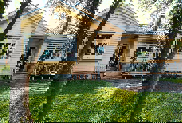 Charming Yellow House With Wooden Windows Green Grassy Garden (1) (1)